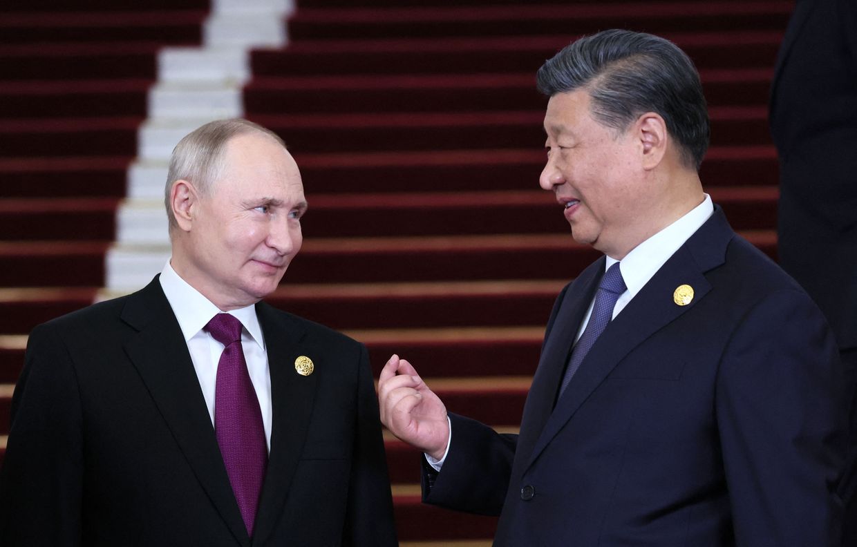 China's Xi tells Putin two countries always move forward 'hand in hand'