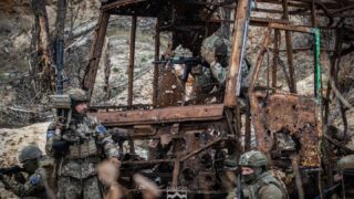 Russian troops target Ukrainian logistics hub in bid to encircle