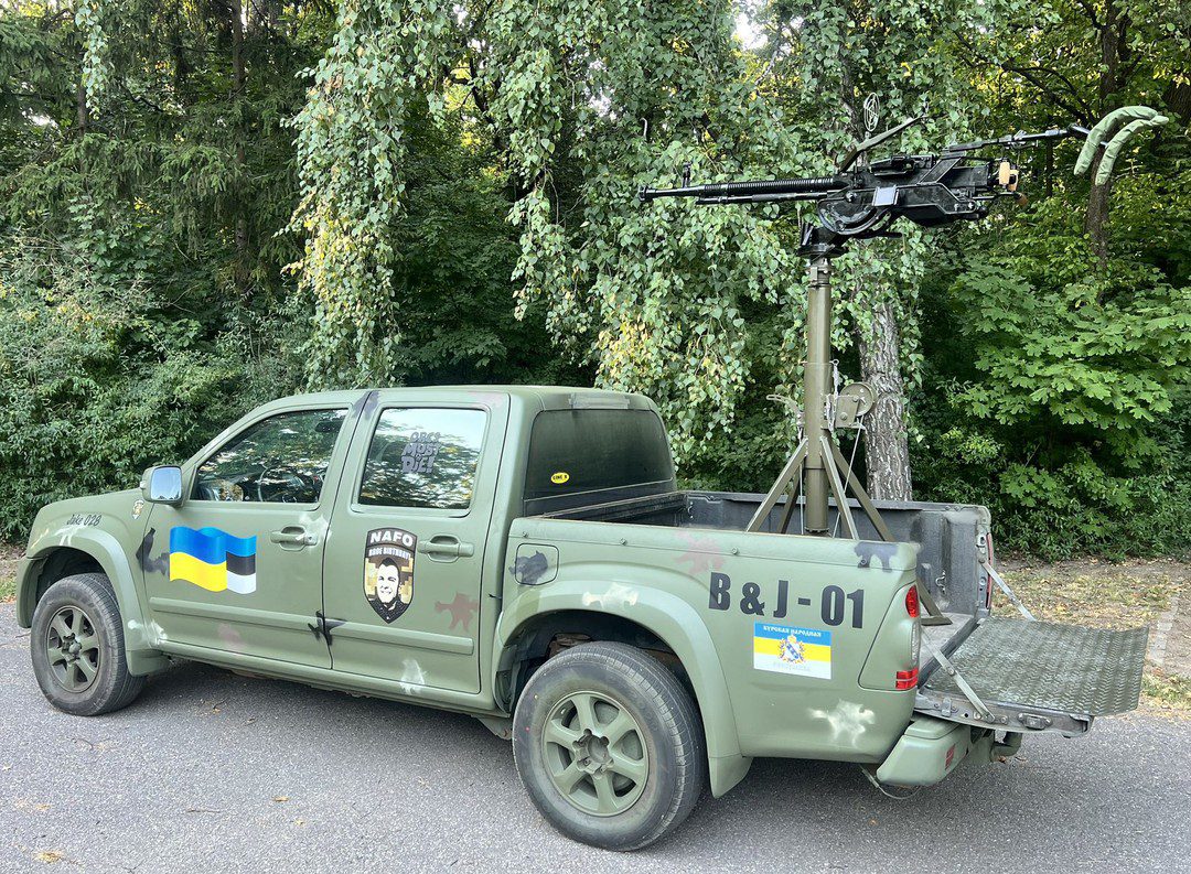 That... is a truck with my face on it that also has an anti-aircraft gun mounted on the back.

Cheer