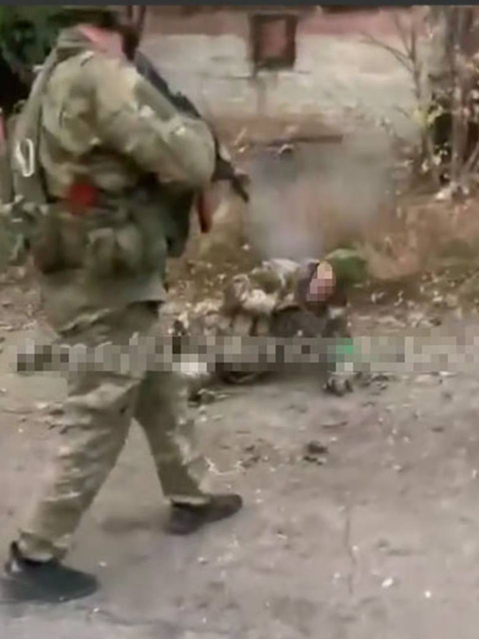 Russians execute unarmed, wounded Ukrainian POW on camera.