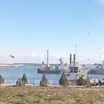 A Ukrainian A-22 drone dives into ship and port infrastructure before detonating.