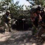 Ukrainian soldiers firing artillery, illustrative image. Photo via Eastnews.ua.