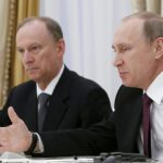 Russian President Vladimir Putin (R) and Presidential Aide Nikolai Patrushev