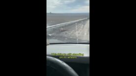 Russian Drives Down a Graveyard of Wrecked Vehicles in Kursk,